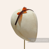 Petershams Millinery Supplies vintage 1950s brown plastic headband with a decorative bow, 8mm band width.