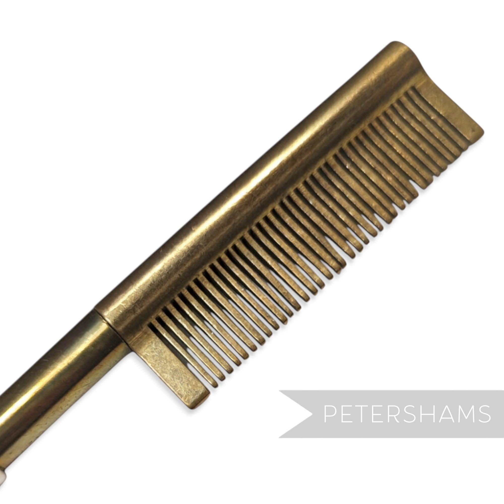 Petershams Millinery Supplies vintage 1940s brass hair straightener comb with black wooden handle. Made in Germany.