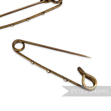 Petershams 62mm vintage brass safety pin with 3 holes for embellishments, ideal for hats and headpieces.