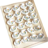 Petershams Millinery Supplies vintage white hat buttons with floral and cherry detail, 1940s/50s style.