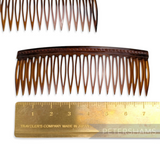 Petershams Millinery Supplies vintage 1950s/60s brown plastic hair comb, 7.5cm wide, short teeth for short hair.