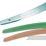 Petershams Millinery Supplies vintage 1960s skinny 8mm wide plastic headband in pastel blue, green, and peach with fine grid pattern and 'Made in England' stamp.