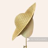 Petershams vintage natural straw capeline hat body with a 11-inch brim, handwoven in a spiral pattern.