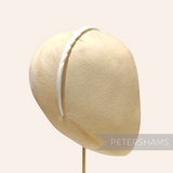 Petershams Millinery Supplies vintage 1960s white skinny headband with swirl pattern and grip spikes.