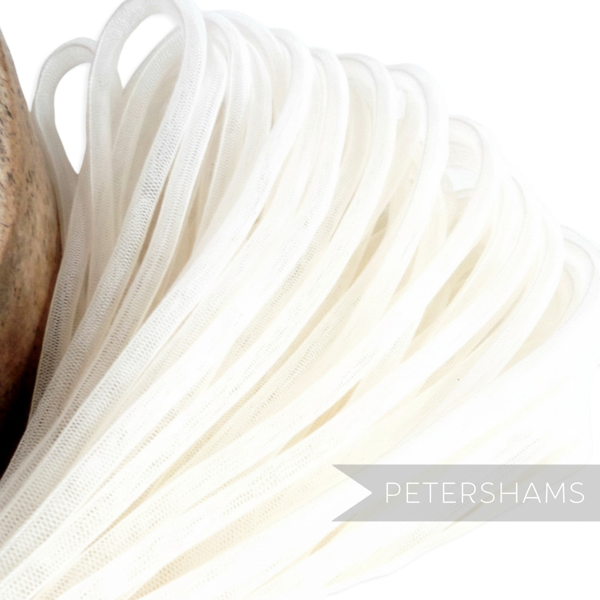 Petershams white 6mm tube crin netting for millinery and hat making. Slightly sheer with gathered sides.