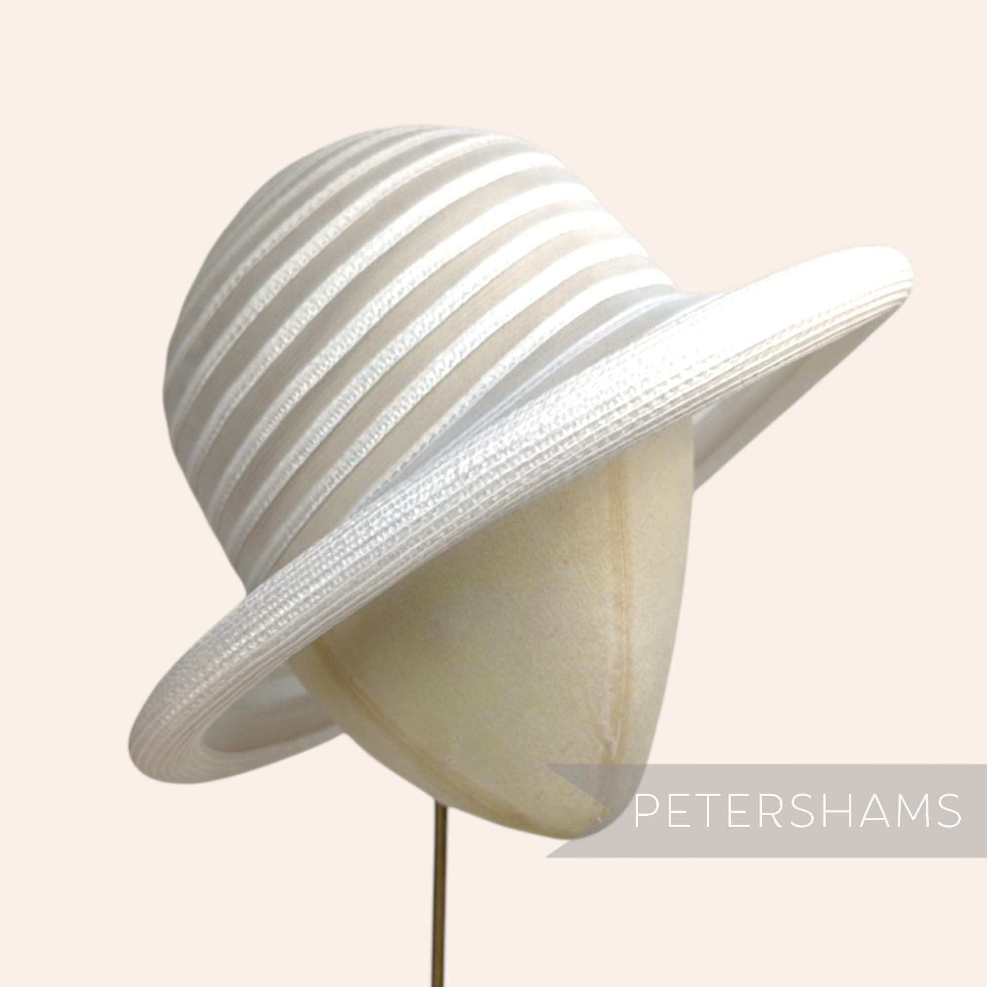 Petershams white crinoline and poly-braid hat base with rolled brim and striped crown.