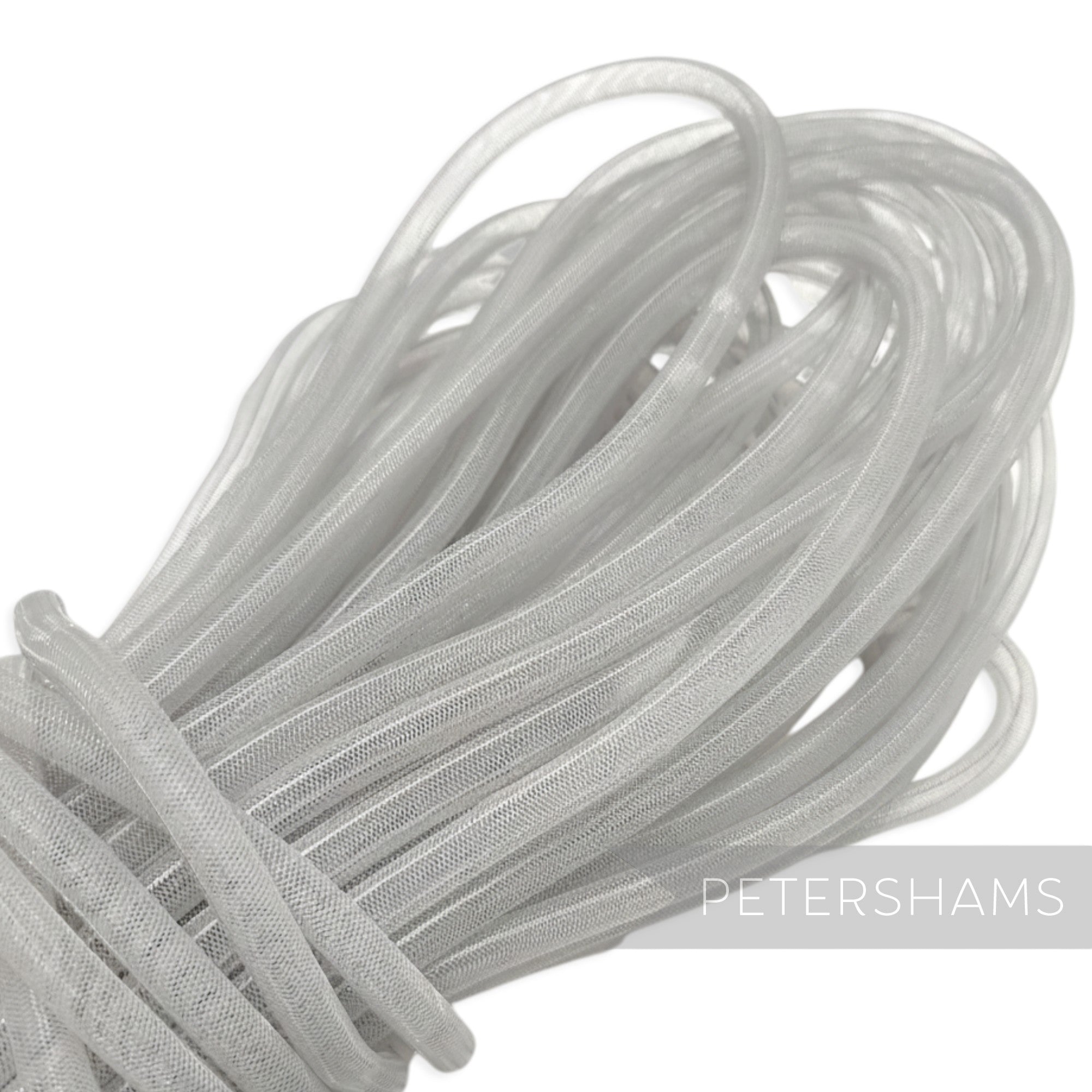 Petershams white 8mm tube millinery crin, a mesh trim for hat making and decorative use.