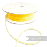Petershams yellow 2.5mm tubular millinery crinoline with a central thread for gathering, sold by the metre.