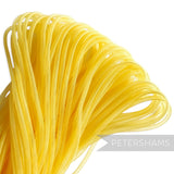Petershams yellow 4mm tube millinery crin, a sheer mesh trim with a gathered side for shaping.