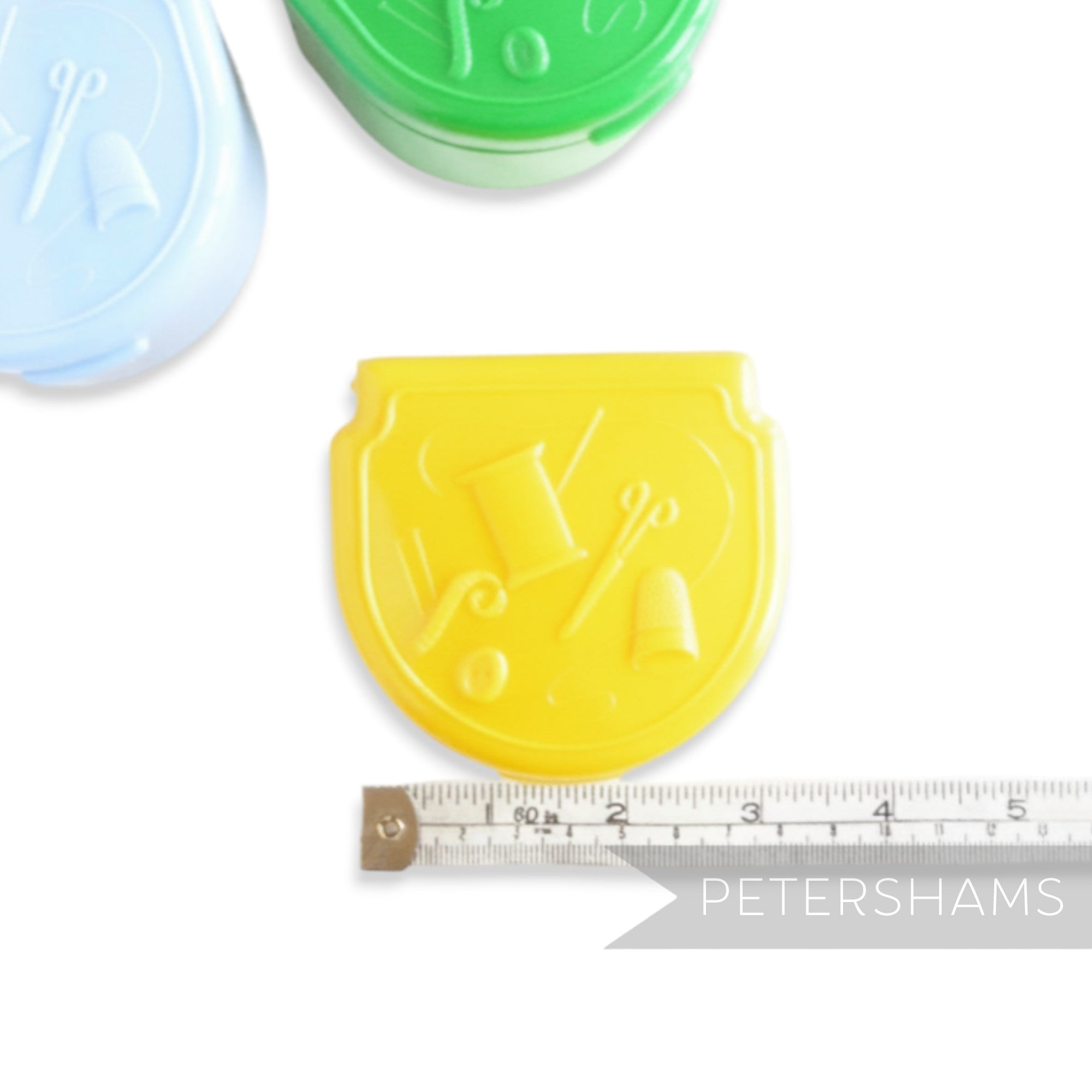 Petershams yellow vintage Presto sewing kit in a plastic case with sewing motifs. Made in England.