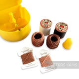Petershams yellow vintage Presto sewing kit with threads, needles, thimble, and original box. Made in England.