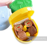 Petershams yellow vintage 'Presto' sewing kit in plastic case with sewing motifs, includes thread, needles, thimble, and instructions.