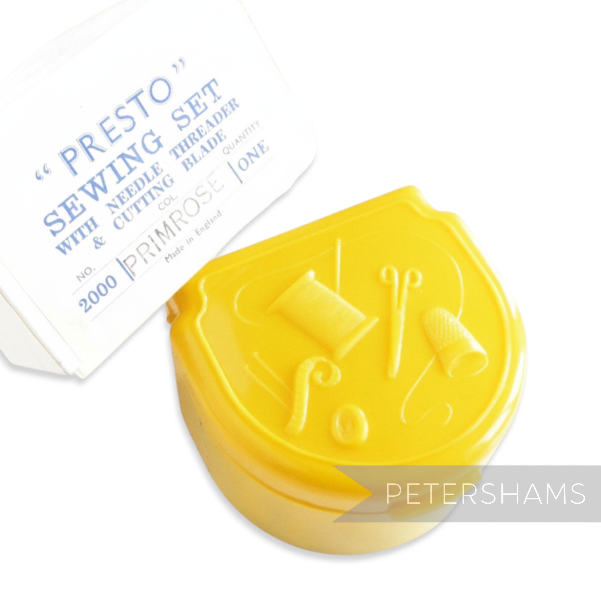Petershams yellow vintage Presto sewing set in plastic case with sewing motifs. Includes needles, threader, thimble, and more.